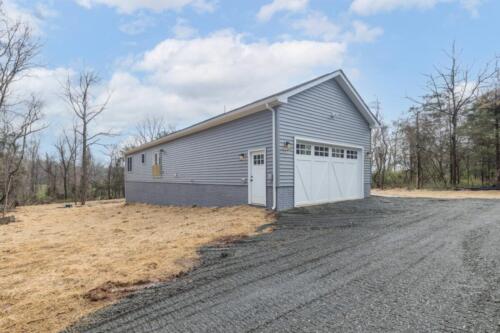 Caliber Home Builder, Hickory III, Back and garage and driveway