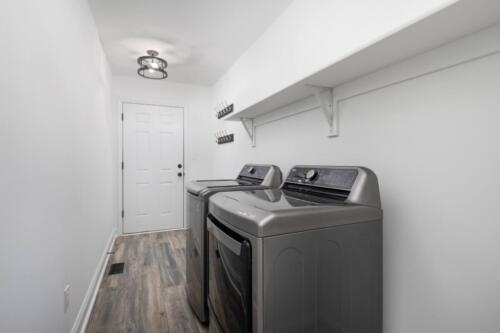 Caliber Home Builder, Hickory III, large laundry room with washer and dryer
