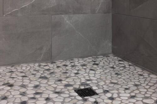 Caliber Home Builder, Hickory III, large master bathroom stone shower flooring