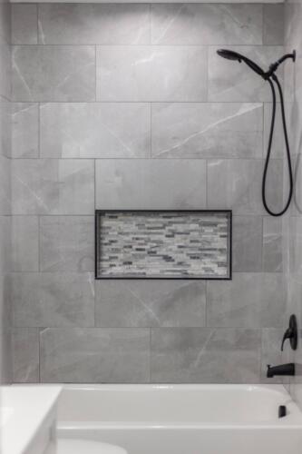 Caliber Home Builder, Hickory III, beautiful second stone bathroom shower