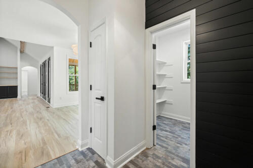 The Corbisiero - elegant farm style home walk-in closet as seen from hall, by Caliber Homebuilder
