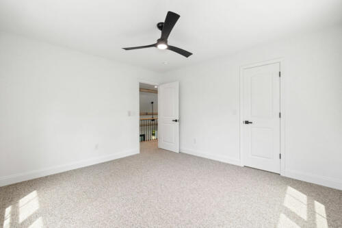The Corbisiero - second floor bedroom with carpet floor, by Caliber Homebuilder