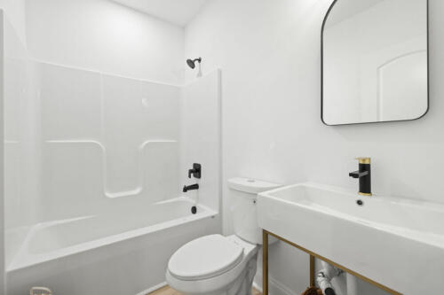 The Corbisiero - simple full bathroom in basement, by Caliber Homebuilder