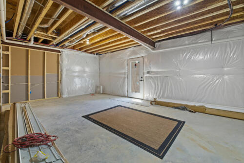 The Corbisiero - unfinished area in basement, by Caliber Homebuilder