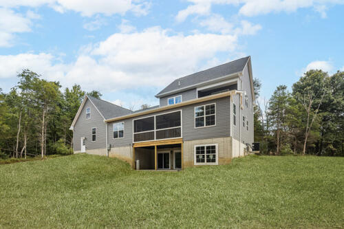 Caliber Home Builder, The Hart, view of the back of the house with all the grass grown in