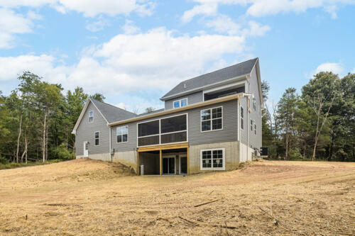 Caliber Home Builder, The Hart, view of the back of the house without fully grown grass