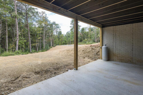 Caliber Home Builder, The Hart, basement patio area leading right to the backyard